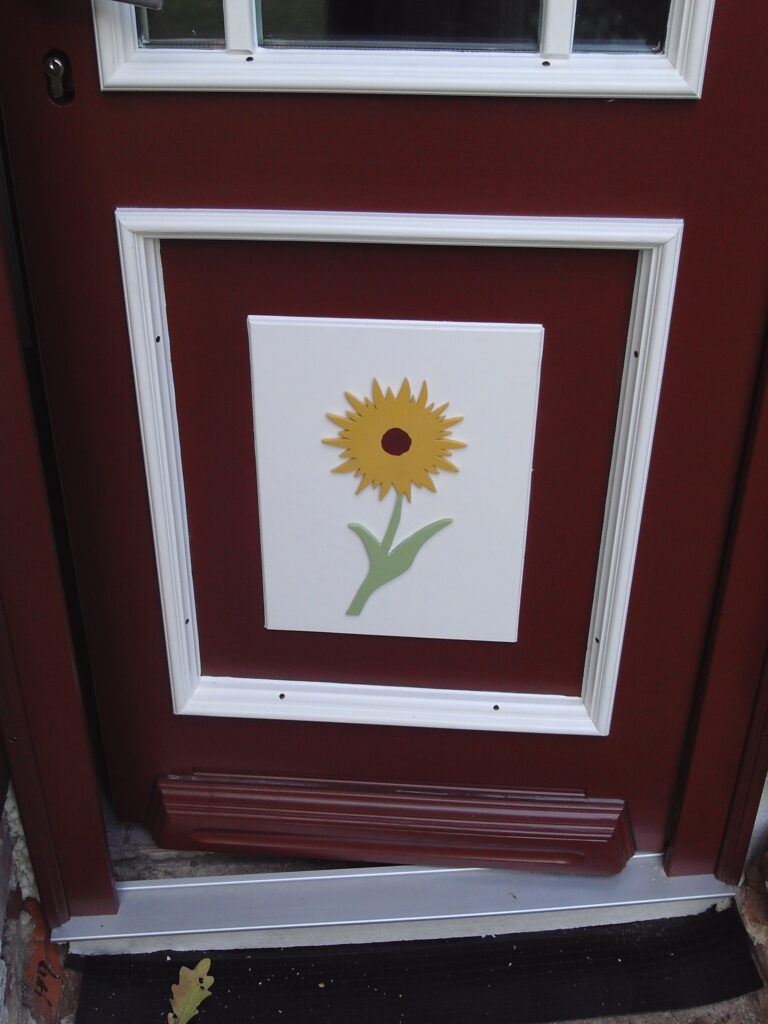 Haustür Detailverzierung mit Sonnenblume von der Tischlerei Eberholz Design